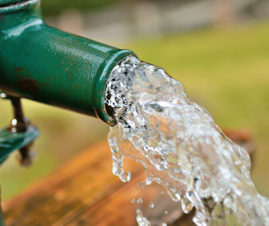 Water from a spout provided by our Idaho well drilling services.